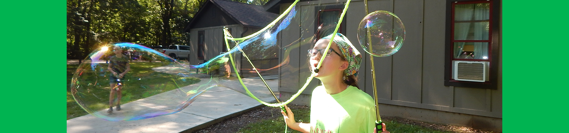  girl scout blowing bubbles at camp torqua 