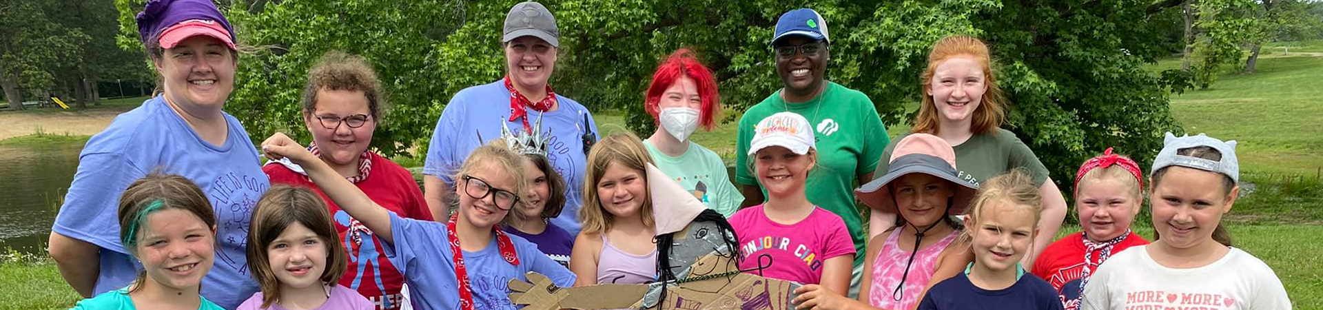  loretta graham with girl scouts at camp 