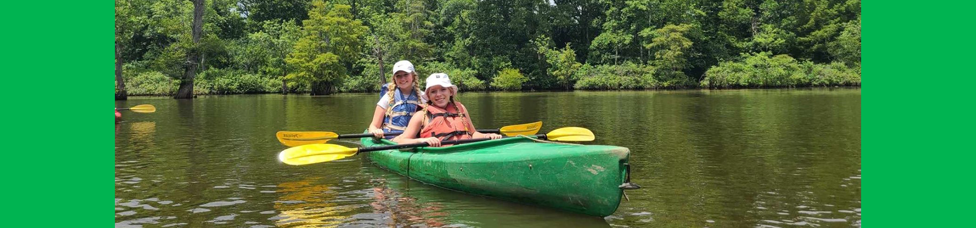  girl scouts kayaking together 