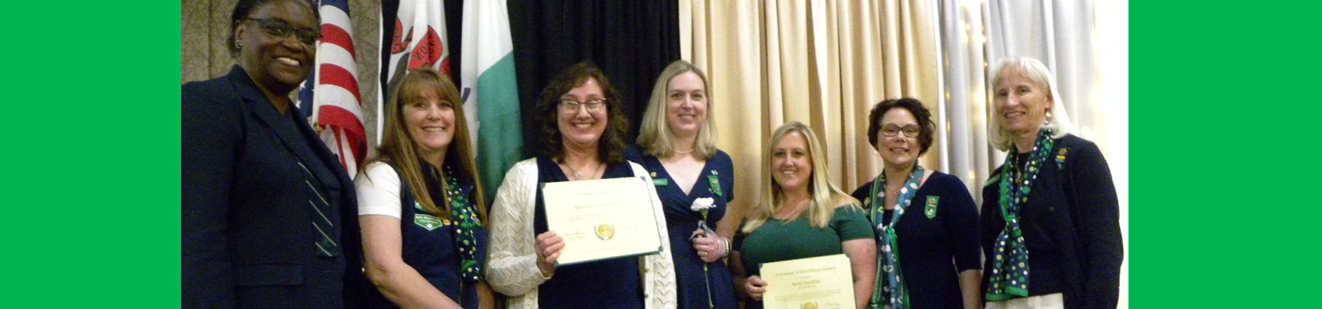  our CEO and board chair posing with adult award winners at our annual recognition ceremony 